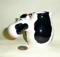 Cow pitcher with big nose for handle