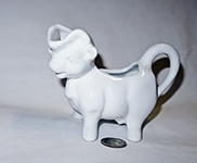 white styanding portuguese cow pitcher
