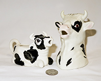 2 American ceramic cow creamers