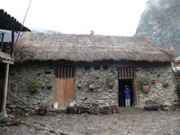 Peruvian home with Toritos de Pucara on roof