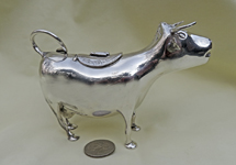 Silver cow creamer with Schuppe-like legs MG & pseudomarks