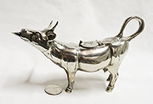 German silver cow with mouth spout, left