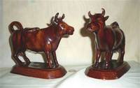 Pair of large Rockingham glazed cow creamers