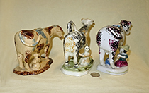 Three cow creamers with milkmaids
