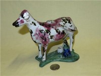 Thin faced red and black sponged cow creamer with small milkmaid