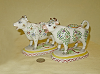 2 Kent style cow creamers with small flowers and leaves, side