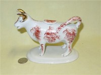White cow creamer with red sponging and gold horns