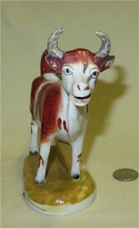 Flat backed wide eyed cow creamer, front