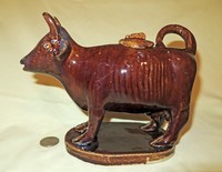 Unusually shaped Rockingham glaze cow creamer