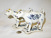 pair of blue and white fairly modern staffordshire cow crewmers
