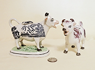 Two Kent style cow creamers