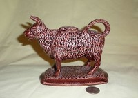 Brown Scottish Hignlands cow creamer