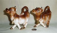 Brown cow creamer and sugar with joined left hooves