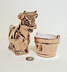 Gold cow with similar sugar bucket