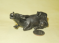 Japanese bronze
bull suiteki with animal on rump