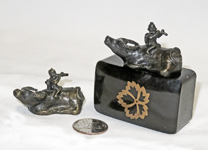 Two Japanese bronze boy with flute on water buffaly suiteki