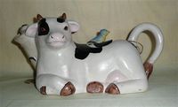 Khein ceramic cow teapot with bluebird on lid