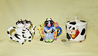 Three miniature cow teapots