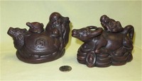 Two Chinese resin water buffalo pots