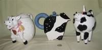 3 fancy cow teapots