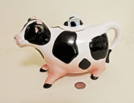 Cow teapot with fly on lid