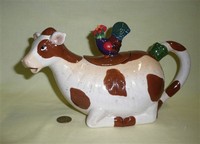 Brown and White cow teapot with rooster on lid