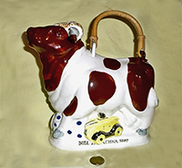 Brown Titcomb bull teapot, left