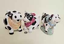 3 Cow Teapots wearing bandanas