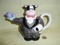 Omnibus cow waiter in grey suit teapot