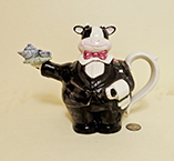 Ombibus cow waiter in black suit teapot