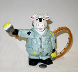 Painter cow teapot