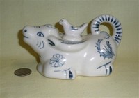 Kneeling blue and white water buffalo teapot with bird on lid