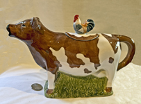 Brown and White cow teapot with rooster on lid
