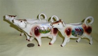 Three German souvenir cow creamers