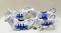 4 German cow creamers with Dutch designs