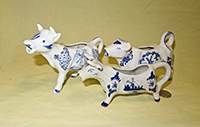 Japanese and unmarked Delft-like cow creamers