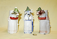 3 Buxom lady in green hat standing S&V cow creamers