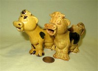 Two small Japanese brown cow caricature creamers