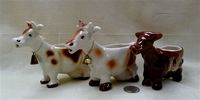 Goebel brown and white cdariucature cow creamer with two look-alikes
