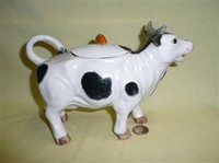 Black and white German cow creamer with lid