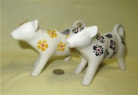 Two Nordstrom's white cow creamers with flowers