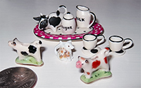 dollhouse sized cow creamers