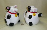 Pudgy black & white cow pitcher and teapot