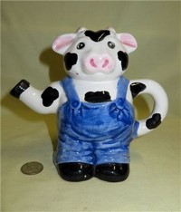 Farmer in blue overalls cow pitcher