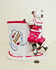 Judy Lotus Cow in red dress holding milk carton container, back
