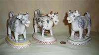 Three Kent style cow creamers