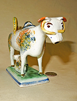 Multicolored sponged cow creamer with long yellow horns, front