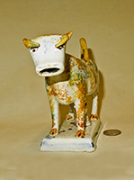 Multi-colored sponge painted cow creamer, front