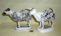 Glamorgan and Cambrian transfer printed cow creamers, left