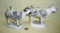 Glamorgan and Cambrian transfer printed cow creamers, right